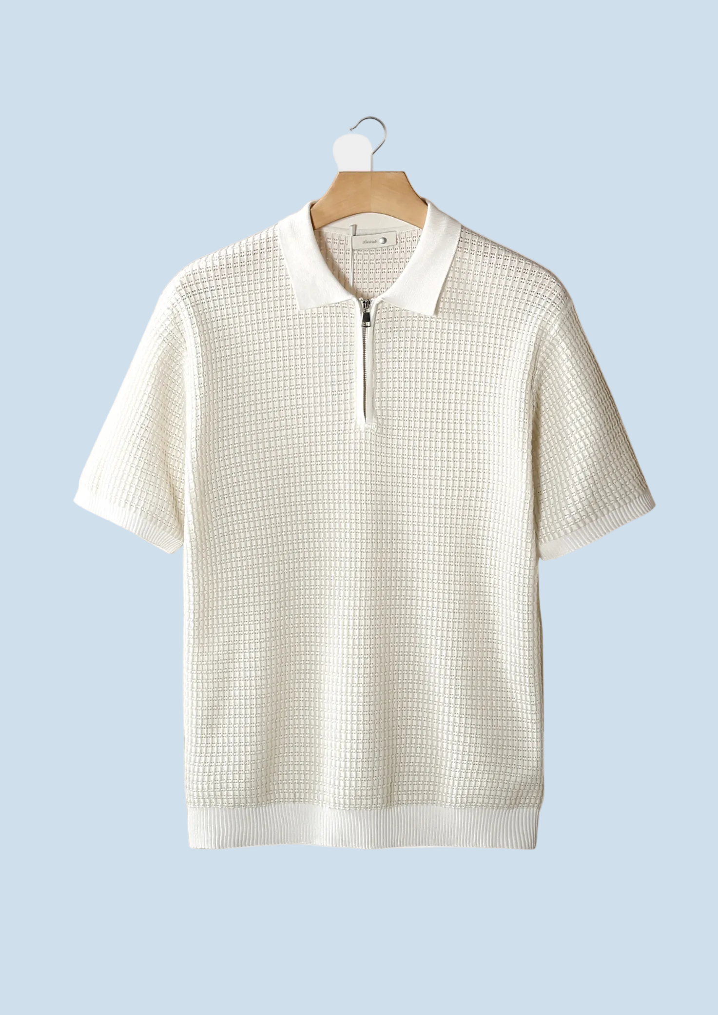 POLO CON CREMALLERA Y TEXTURA GEOMÉTRICA